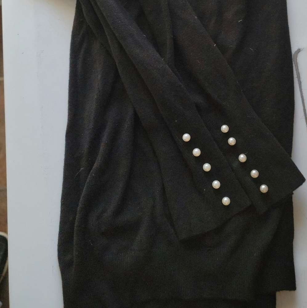Turtleneck sweater with embellishments